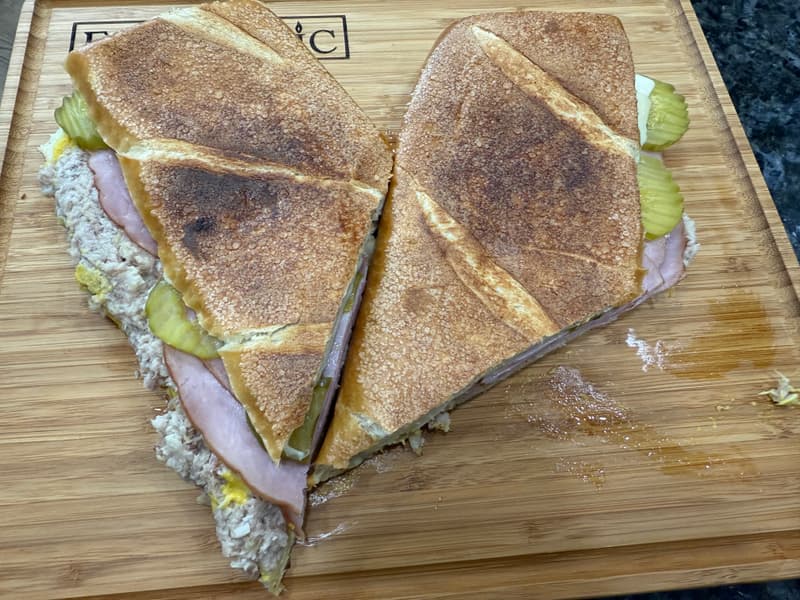 Cuban sandwich split open showing the layers